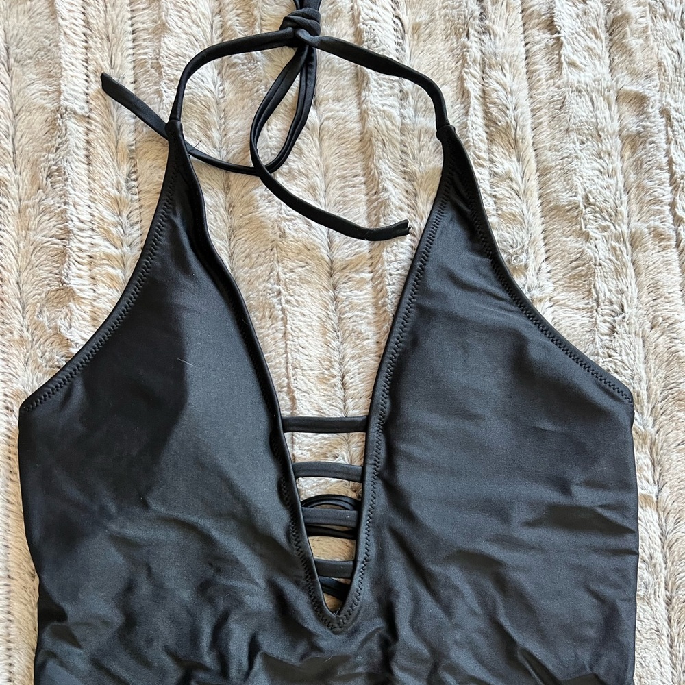 Black one piece low cut swimsuit